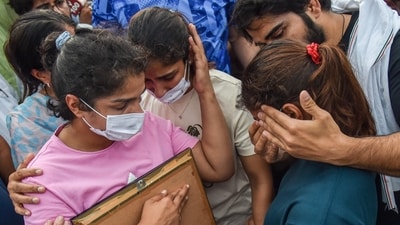 Protesting wrestlers Sakshi Malik, Vinesh Phogat and Sangeeta Phogat at Har ki Pauri ghat, in Haridwar, Tuesday, May 30, 2023. (PTI) Protesting wrestlers Sakshi Malik, Vinesh Phogat and Sangeeta Phogat at Har ki Pauri ghat, in Haridwar, Tuesday, May 30, 2023. (PTI)