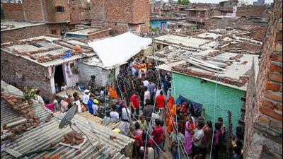 People near the spot of crime, at Shahbad Dairy on Tuesday. (Sanchit Khanna/HT Photo) People near the spot of crime, at Shahbad Dairy on Tuesday. (Sanchit Khanna/HT Photo)