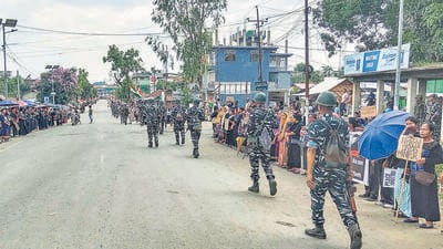Security personnel on a route march at Churachandpur in Manipur on Tuesday. (PTI) Security personnel on a route march at Churachandpur in Manipur on Tuesday. (PTI)