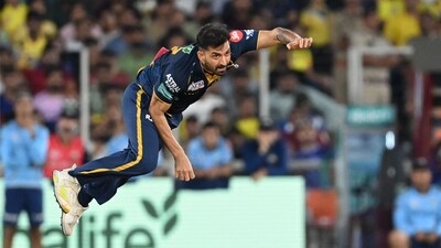 Gujarat Titans' Mohit Sharma bowls during the Indian Premier League (IPL) Twenty20 final cricket match between Gujarat Titans and Chennai Super Kings (AFP) Gujarat Titans' Mohit Sharma bowls during the Indian Premier League (IPL) Twenty20 final cricket match between Gujarat Titans and Chennai Super Kings (AFP)