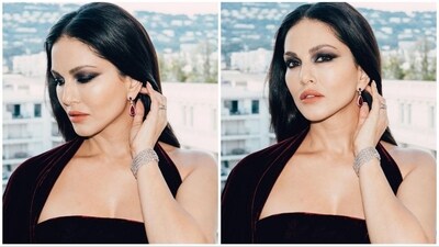 Assisted by makeup artist Tomas Moucka, Sunny Leone rocked a smokey eye look with black shimmer eyeshadow, voluminous mascara-coated lashes, contoured cheeks, and a glossy orange lipstick. (Instagram/@sunnyleone) Assisted by makeup artist Tomas Moucka, Sunny Leone rocked a smokey eye look with black shimmer eyeshadow, voluminous mascara-coated lashes, contoured cheeks, and a glossy orange lipstick. (Instagram/@sunnyleone)