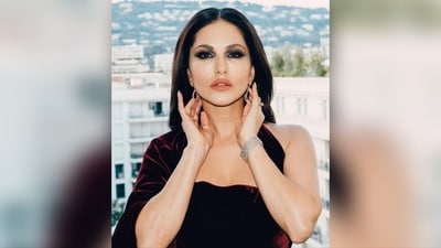 Sunny Leone complemented her Cannes look with elegant maroon diamond drop earrings, a diamond bracelet on her wrist, and stacked rings adorning her fingers. (Instagram/@sunnyleone) Sunny Leone complemented her Cannes look with elegant maroon diamond drop earrings, a diamond bracelet on her wrist, and stacked rings adorning her fingers. (Instagram/@sunnyleone)