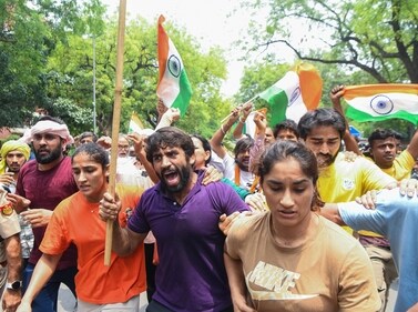 Wrestlers Bajrang Punia, Vinesh Phogat and Sangeeta Phogat along with supporters take out a protest march from Jantar Mantar to new Parliament building against the alleged sexual harassment of women wrestlers by WFI chief Brij Bhushan Sharan Singh in New Delhi on Sunday. (ANI) Wrestlers Bajrang Punia, Vinesh Phogat and Sangeeta Phogat along with supporters take out a protest march from Jantar Mantar to new Parliament building against the alleged sexual harassment of women wrestlers by WFI chief Brij Bhushan Sharan Singh in New Delhi on Sunday. (ANI)