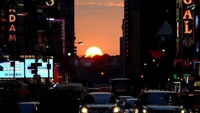 The sun sets as seen from 42nd street in New York City, as Manhattanhenge, sometimes also referred to as Manhattan Solstice, the biannual natural event, when it is perfectly aligned with Manhattan’s numbered streets.