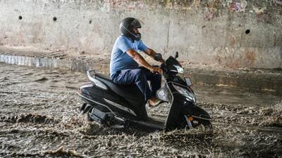 A commuter wades through a waterlogged stretch at Pandav Nagar underpass following heavy rains in New Delhi. (Raj K Raj/HT) A commuter wades through a waterlogged stretch at Pandav Nagar underpass following heavy rains in New Delhi. (Raj K Raj/HT)