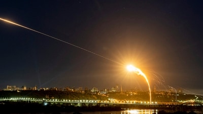 Ukrainian air defense intercepts a Shahed drone mid-air in the third Russia aerial attack in Kyiv. (AP)