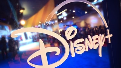 (FILES) This file picture taken on on September 9, 2022 shows fans are reflected in Disney+ logo during the Walt Disney D23 Expo in Anaheim, California. Subscribers to Disney Plus fell for the second straight quarter, the company said on May 10, 2023, though it stemmed financial losses as it competes with Netflix for viewers. (Photo by Patrick T. FALLON / AFP) (AFP) (FILES) This file picture taken on on September 9, 2022 shows fans are reflected in Disney+ logo during the Walt Disney D23 Expo in Anaheim, California. Subscribers to Disney Plus fell for the second straight quarter, the company said on May 10, 2023, though it stemmed financial losses as it competes with Netflix for viewers. (Photo by Patrick T. FALLON / AFP) (AFP)