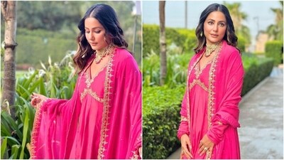 Hina accessorised the ensemble with Kolhapuri style block heels, statement rings, and a gold and Kundan choker necklace with ruby gem embellishments. Lastly, she chose centre-parted open wavy locks, bold black eyeliner, nude lip shade, subtle eye shadow, rouged cheeks, a dewy base, mascara on the lashes, and feathered brows for the glam picks. (Instagram) Hina accessorised the ensemble with Kolhapuri style block heels, statement rings, and a gold and Kundan choker necklace with ruby gem embellishments. Lastly, she chose centre-parted open wavy locks, bold black eyeliner, nude lip shade, subtle eye shadow, rouged cheeks, a dewy base, mascara on the lashes, and feathered brows for the glam picks. (Instagram)
