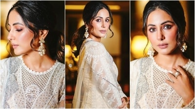 Hina's anarkali kurta features a round neckline, intricate chikankari embroidery, sequin embellishments, a cinched waist, layered ghera, and sheer panelling. She teamed it with matching churidar pants. (Instagram ) Hina's anarkali kurta features a round neckline, intricate chikankari embroidery, sequin embellishments, a cinched waist, layered ghera, and sheer panelling. She teamed it with matching churidar pants. (Instagram )