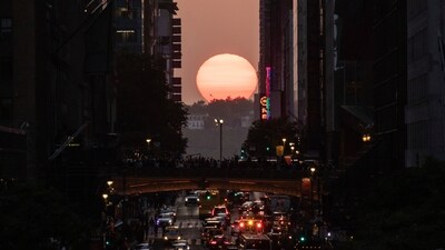 The sun sets as seen through the middle of buildings along 42nd Street in New York during a phenomenon known as Manhattanhenge. (AP Photo/Yuki Iwamura) The sun sets as seen through the middle of buildings along 42nd Street in New York during a phenomenon known as Manhattanhenge. (AP Photo/Yuki Iwamura)