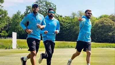 Virat Kohli (R) with bowlers Umesh Yadav (L) and Mohammed Siraj at a practice session ahead of the World Test Championship final match between India and Australia, in UK (PTI)