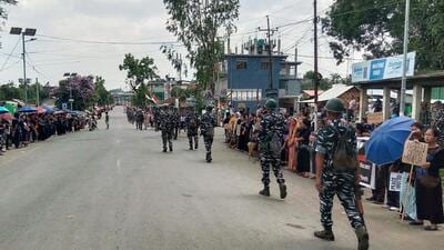 Security personnel patrol an area in Churachandpur. (ANI)