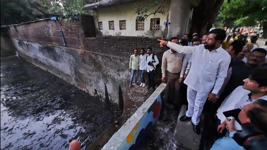 Thane, India - May 22, 2023: Maharashtra CM Eknath Shinde inspects nullah before monsoon, at Anand Nagar, on Ghodbunder Road, in Thane, in Thane, India, on Monday, May 22, 2023. (Praful Gangurde/HT Photo) (HT PHOTO)