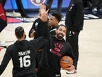 May 31, 2023; Denver, CO, USA; Miami Heat guard Gabe Vincent (right) and forward Caleb Martin (16) high five during a practice session on media day before the 2023 NBA Finals at Ball Arena. Mandatory Credit: Kyle Terada-USA TODAY Sports