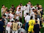 Sevilla coach Jose Mendilibar talks to players before extra time