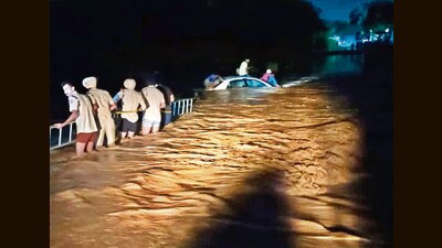Firefighters rescuing the four men who were trapped in the Patiala Ki Rao stream past Thursday midnight. Three of them had hired the cab from Sector 38 for Kartarpur, Punjab. (HT Photo) Firefighters rescuing the four men who were trapped in the Patiala Ki Rao stream past Thursday midnight. Three of them had hired the cab from Sector 38 for Kartarpur, Punjab. (HT Photo)