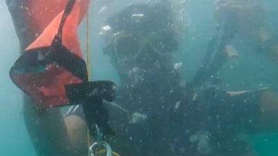 A video posted by ANI showed the diving operations where Indian Coast Guard personnel could be seen going underwater with a knife. A video posted by ANI showed the diving operations where Indian Coast Guard personnel could be seen going underwater with a knife.
