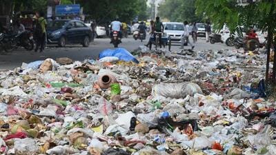 Gurugram, India-June 01, 2023: The Municipal Corporation of Gurugram (MCG) will get the outsourced sweepers to remove the garbage spread on the Khandsa road near Rajesh Khurana park, in Gurugram, India, on Thursday, 01 June 2023. (Photo by Parveen Kumar/Hindustan Times)(Pic to go with Leena Dhankar's story) Gurugram, India-June 01, 2023: The Municipal Corporation of Gurugram (MCG) will get the outsourced sweepers to remove the garbage spread on the Khandsa road near Rajesh Khurana park, in Gurugram, India, on Thursday, 01 June 2023. (Photo by Parveen Kumar/Hindustan Times)(Pic to go with Leena Dhankar's story)