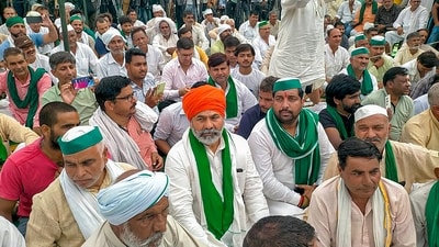 Bharatiya Kisan Union (BKU) leader Rakesh Tikait addresses a Khap 'Mahapanchayat' organised over the ongoing protest by wrestlers against WFI President Brij Bhushan Sharan Singh, at Soram village, in Muzaffarnagar, Thursday. (PTI) Bharatiya Kisan Union (BKU) leader Rakesh Tikait addresses a Khap 'Mahapanchayat' organised over the ongoing protest by wrestlers against WFI President Brij Bhushan Sharan Singh, at Soram village, in Muzaffarnagar, Thursday. (PTI)