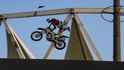 A motorcyclist performs stunts during the launch of Indian Supercross Racing League and unveiling of its logo, in New Delhi. (PTI) A motorcyclist performs stunts during the launch of Indian Supercross Racing League and unveiling of its logo, in New Delhi. (PTI)