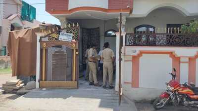 Police attaching the house in Allahpur locality of Prayagaraj on Thursday. (HT Photo)