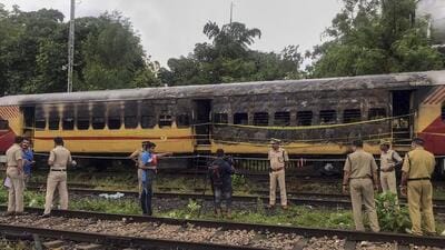Police inspect the train. (PTI) Police inspect the train. (PTI)