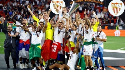 Sevilla celebrate with the trophy after winning the Europa League (REUTERS)