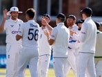 England's Josh Tongue celebrates with Stuart Broad and teammates after taking the wicket of Ireland's Paul Stirling