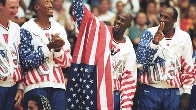 FILE PHOTO: U.S. basketball player Michael Jordan (2nd R) flashes a victory sign as he stands with team mates Larry Bird (L), Scottie Pippen and Clyde Drexler (R), nicknamed the "Dream Team" after winning the Olympic gold in Barcelona, Spain on August 8, 1992.   REUTERS/Ray Stubblebine/File Photo (REUTERS)
