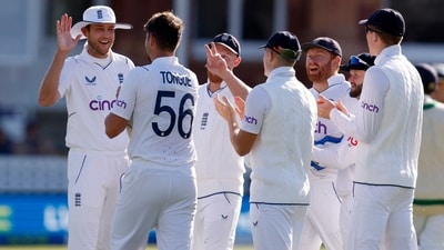 England's Josh Tongue celebrates with Stuart Broad and teammates after taking the wicket of Ireland's Paul Stirling (Action Images via Reuters)