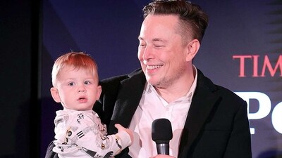 Elon Musk and his son X Æ A-12. Elon Musk and his son X Æ A-12.