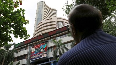 A man looks at a screen across a road displaying the Sensex on the facade of the Bombay Stock Exchange (BSE) building in Mumbai, India. (File image) (REUTERS)
