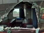 Shattered window panels of the Yeshwantpur-Howrah Express as some of its coaches reach Howrah railway station in West Bengal on Saturday. Shattered window panels of the Yeshwantpur-Howrah Express as some of its coaches reach Howrah railway station in West Bengal on Saturday.