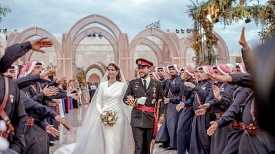 Jordan's Crown Prince Hussein and Saudi Rajwa Alseif walk during their wedding ceremonies in Amman, Jordan. (AP) Jordan's Crown Prince Hussein and Saudi Rajwa Alseif walk during their wedding ceremonies in Amman, Jordan. (AP)