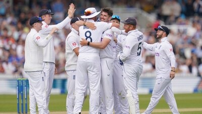 England's Josh Tongue, center right, celebrates with England's Stuart Broad after claiming the wicket of Ireland's Fionn Hand during day three of the first Test (AP) England's Josh Tongue, center right, celebrates with England's Stuart Broad after claiming the wicket of Ireland's Fionn Hand during day three of the first Test (AP)