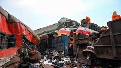 Rescue workers recover victims' bodies from a carriage wreckage of a three-train collision near Balasore, Odisha, on Saturday. (AFP)