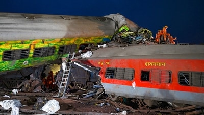 Rescue workers recover victims' bodies from the carriage wreckage of a three-train collision near Balasore, in Odisha, on Saturday. (AFP) Rescue workers recover victims' bodies from the carriage wreckage of a three-train collision near Balasore, in Odisha, on Saturday. (AFP)