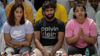 Indian wrestlers Vinesh Phogat, Bajrang Punia, and Sakshi Malik address a news conference. (REUTERS)