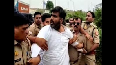 Police stopping MLA Atul Pradhan. (HT) Police stopping MLA Atul Pradhan. (HT)