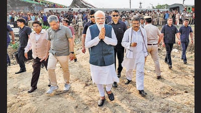 Prime Minister Narendra Modi visits the site of the accident involving Coromandel Express, Bengaluru-Howrah Express and a goods train, in Balasore district on Saturday. (PTI) Prime Minister Narendra Modi visits the site of the accident involving Coromandel Express, Bengaluru-Howrah Express and a goods train, in Balasore district on Saturday. (PTI)
