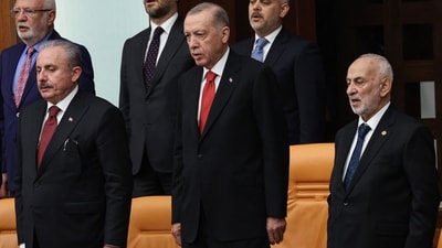 Turkish President Recep Tayyip Erdogan (C), former Speaker of the Turkish Grand National Assembly Mustafa Sentop (L) and new elected Yeniden Refah party's MP Suat Pamukcu (R)stand during the 28th term deputies' oath-taking ceremony at the Turkish Grand National Assembly in Ankara, on June 02, 2023. (AFP) Turkish President Recep Tayyip Erdogan (C), former Speaker of the Turkish Grand National Assembly Mustafa Sentop (L) and new elected Yeniden Refah party's MP Suat Pamukcu (R)stand during the 28th term deputies' oath-taking ceremony at the Turkish Grand National Assembly in Ankara, on June 02, 2023. (AFP)
