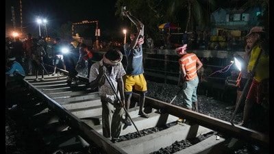 Workers endeavour to restore the normal train services as they reinstall railway tracks in Odisha on Saturday. (PTI) Workers endeavour to restore the normal train services as they reinstall railway tracks in Odisha on Saturday. (PTI)