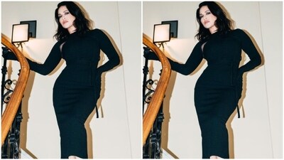 Sunny decked up in a long black dress with full sleeves, closed neckline and belt details at the waist. The dress came with see-through mesh details in the neckline.&nbsp; (Instagram/@sunnyleone)