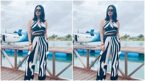 Styled by fashion stylist Hitendra Kapopara, Sunny wore her tresses open in straight locks with a middle part and decked up in contoured cheeks and a shade of nude lipstick.&nbsp;(Instagram/@sunnyleone)