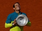 Spain's Rafael Nadal celebrates with trophy after winning the 2022 French Open men's singles final against Norway's Casper Ruud 