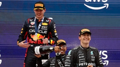 Winner Red Bull driver Max Verstappen of the Netherlands, left, second placed Mercedes driver Lewis Hamilton of Britain and third placed Mercedes driver George Russell of Britain celebrate after the Spanish Formula One Grand Prix. (AP) Winner Red Bull driver Max Verstappen of the Netherlands, left, second placed Mercedes driver Lewis Hamilton of Britain and third placed Mercedes driver George Russell of Britain celebrate after the Spanish Formula One Grand Prix. (AP)