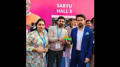 Co-founders Sakshi Jha and Sarfaraz Ali with Union minister Anurag Thakur at the G20 summit with a logo memento created from recycled plastic waste. (HT Photo) Co-founders Sakshi Jha and Sarfaraz Ali with Union minister Anurag Thakur at the G20 summit with a logo memento created from recycled plastic waste. (HT Photo)