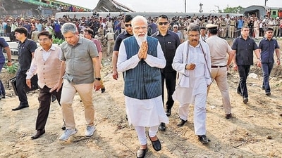 Prime Minister Narendra Modi visits the site of the accident involving Coromandel Express, Bengaluru-Howrah Express and a goods train, in Balasore district on Saturday. (PTI) Prime Minister Narendra Modi visits the site of the accident involving Coromandel Express, Bengaluru-Howrah Express and a goods train, in Balasore district on Saturday. (PTI)