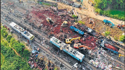 Rescue and restoration operations at the crash site in Balasore on Sunday. (AFP) Rescue and restoration operations at the crash site in Balasore on Sunday. (AFP)