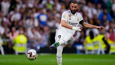 Real Madrid's Karim Benzema kicks the ball during a Spanish La Liga soccer match between Real Madrid and Rayo Vallecano at the Santiago Bernabeu stadium in Madrid, Spain, Wednesday, May 24, 2023. (AP Photo/Manu Fernandez) (AP)